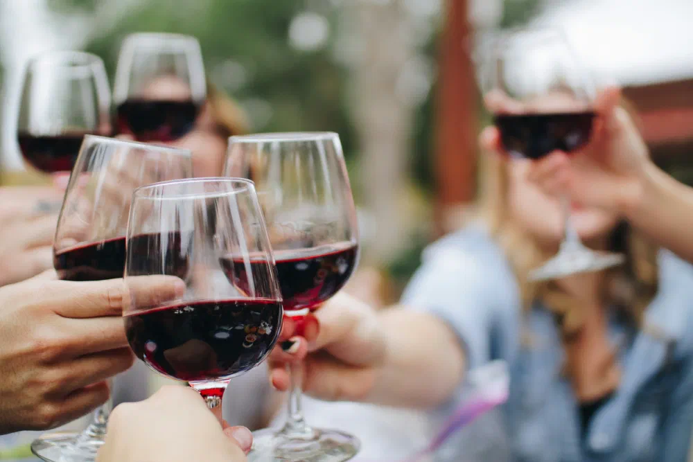 Clinking wine glasses